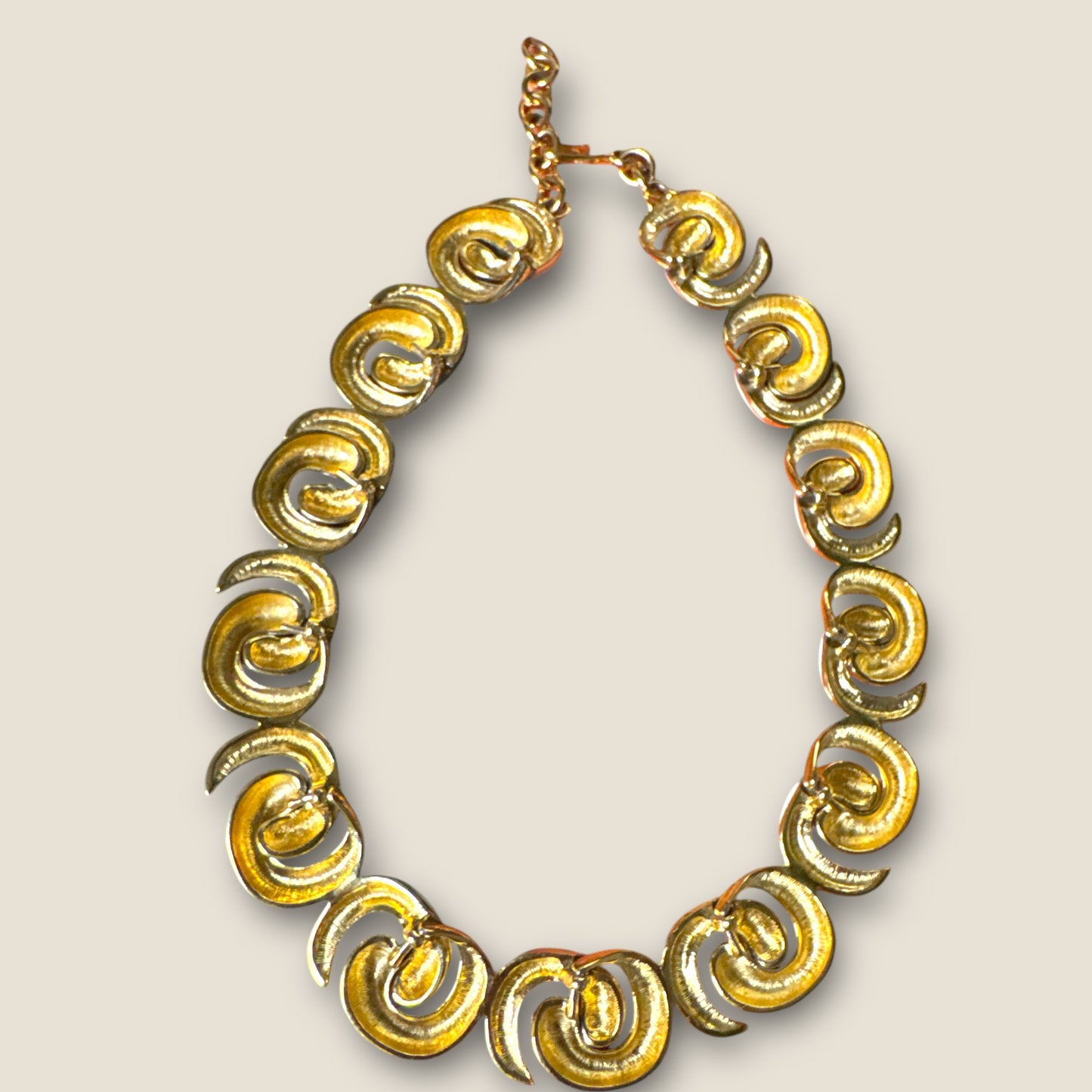 Vintage Monet Cream Enamel Sculptural Swirl Necklace – Gold-Tone Articulated Choker (Signed Monet)