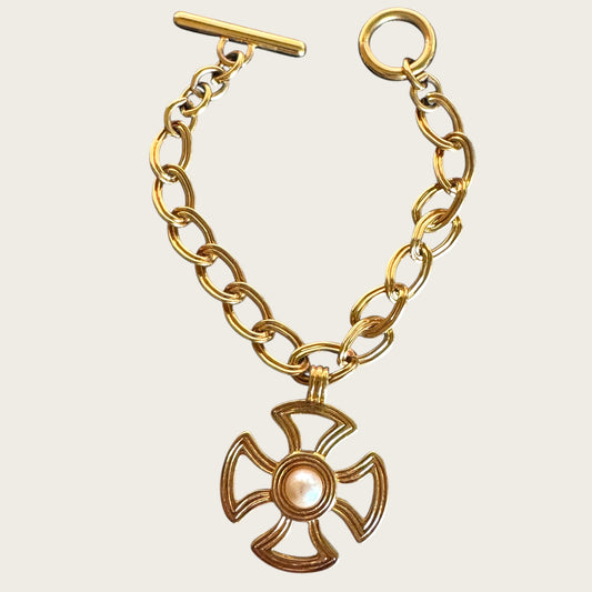 Vintage Monet Gold Tone Toggle Necklace with Sculptural Cross Medallion