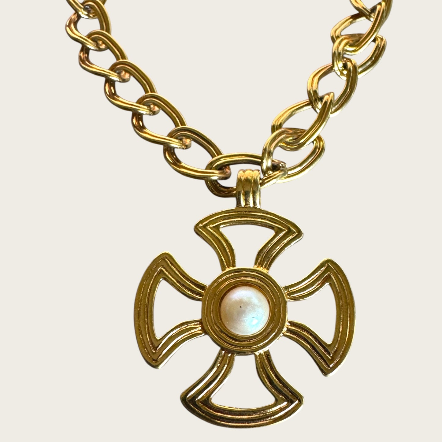 Vintage Monet Gold Tone Toggle Necklace with Sculptural Cross Medallion