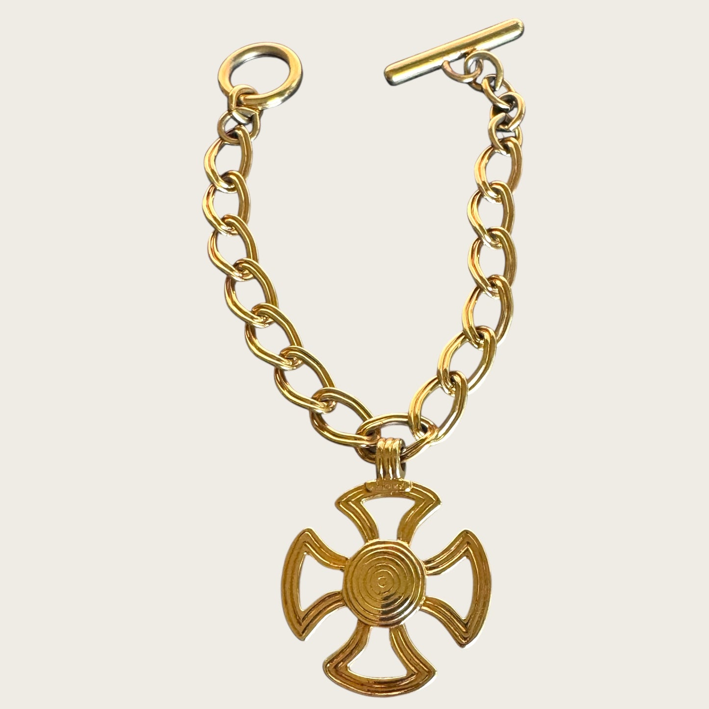 Vintage Monet Gold Tone Toggle Necklace with Sculptural Cross Medallion