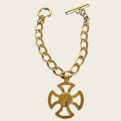 Vintage Monet Gold Tone Toggle Necklace with Sculptural Cross Medallion