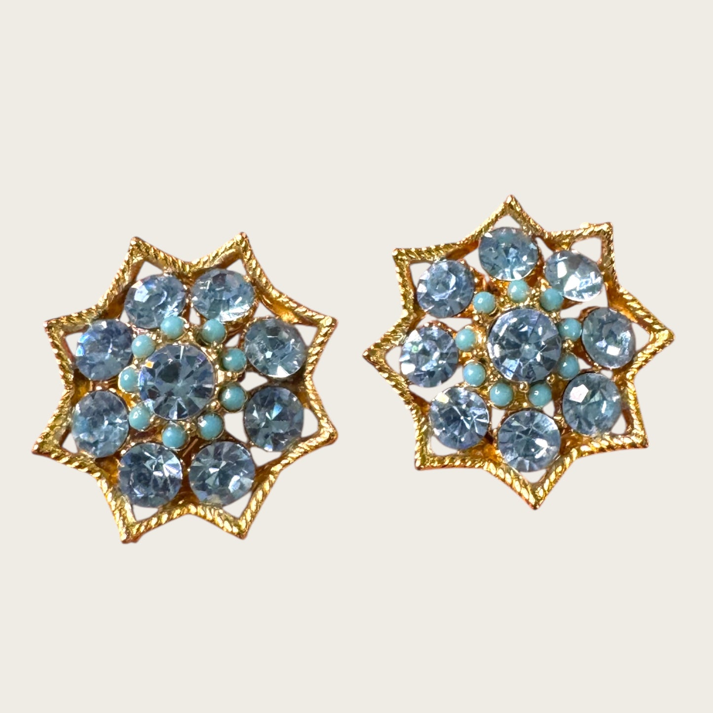 BSK Signed Blue Rhinestone Starburst Clip-On Earrings, Gold Tone Vintage Statement