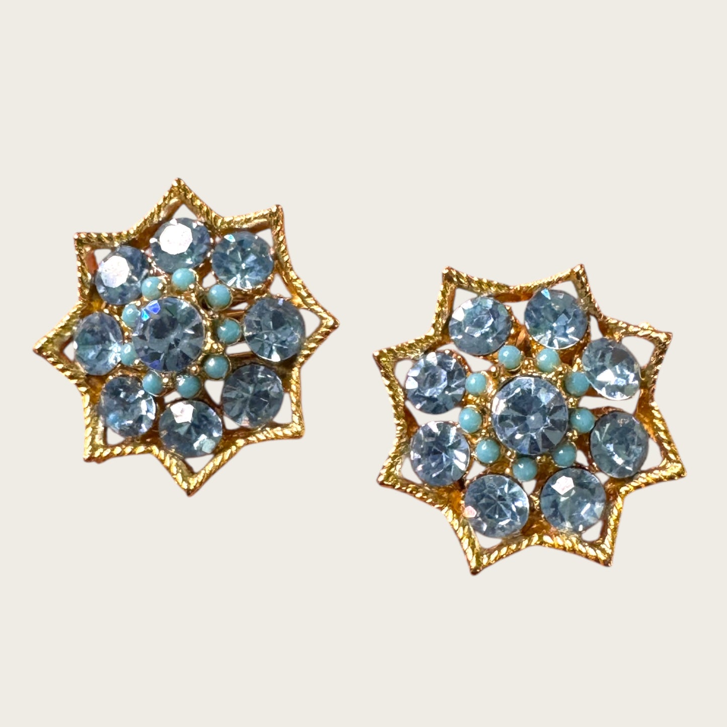 BSK Signed Blue Rhinestone Starburst Clip-On Earrings, Gold Tone Vintage Statement